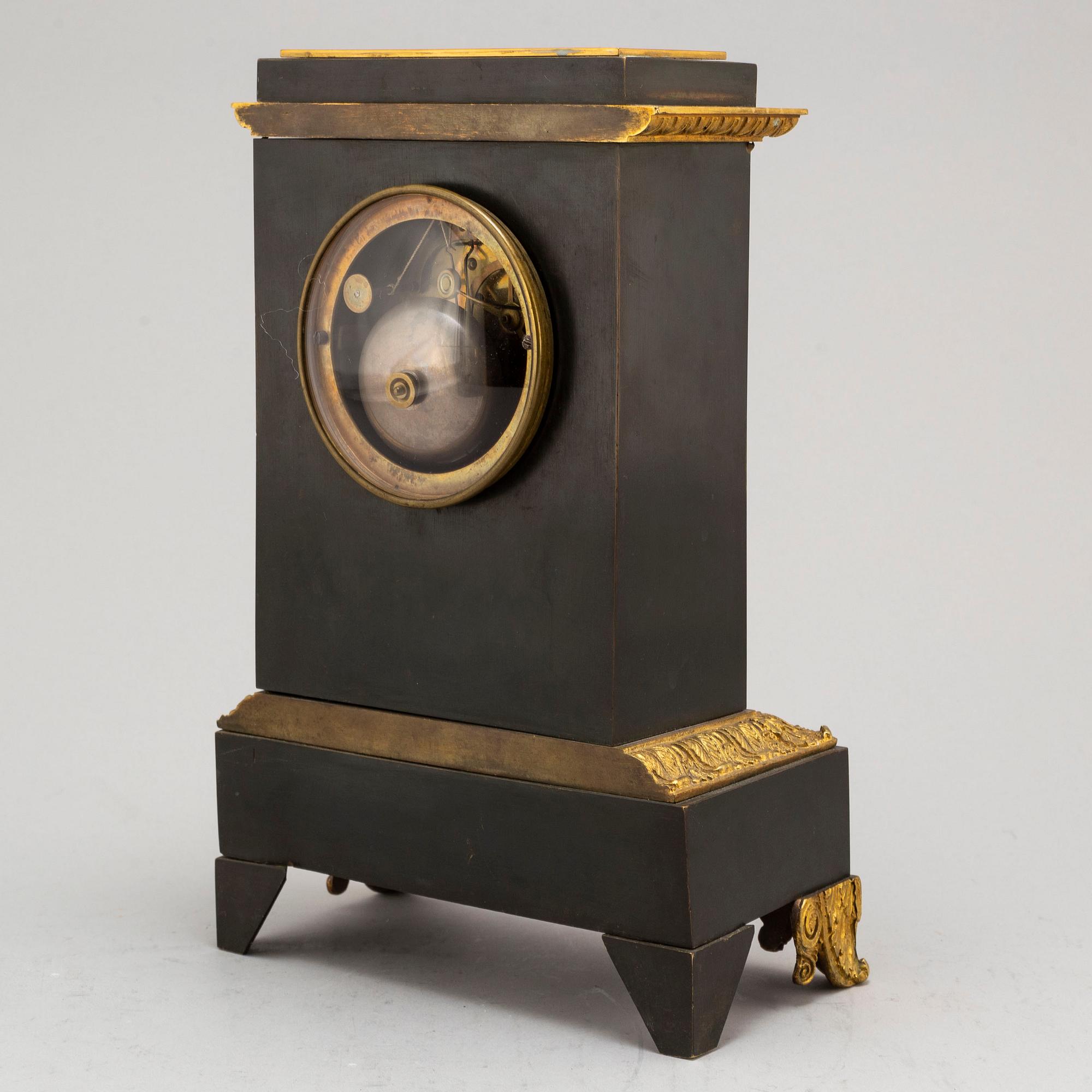 An Empire-style late 19th century mantel clock.