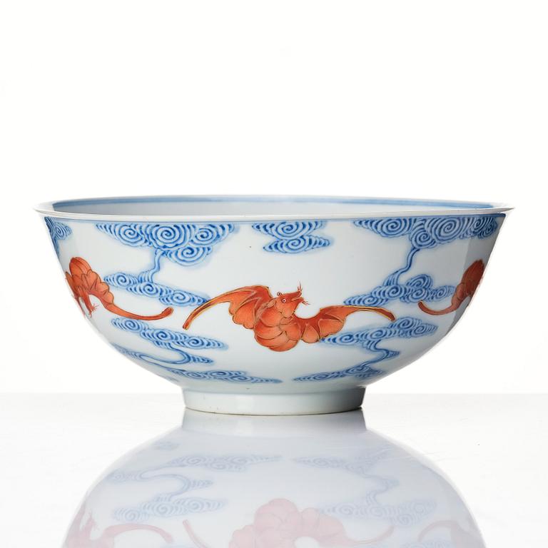 A Chinese iron-red-decorated blue and white Wufu bat bowl, late Qing dynasty, around 1900.