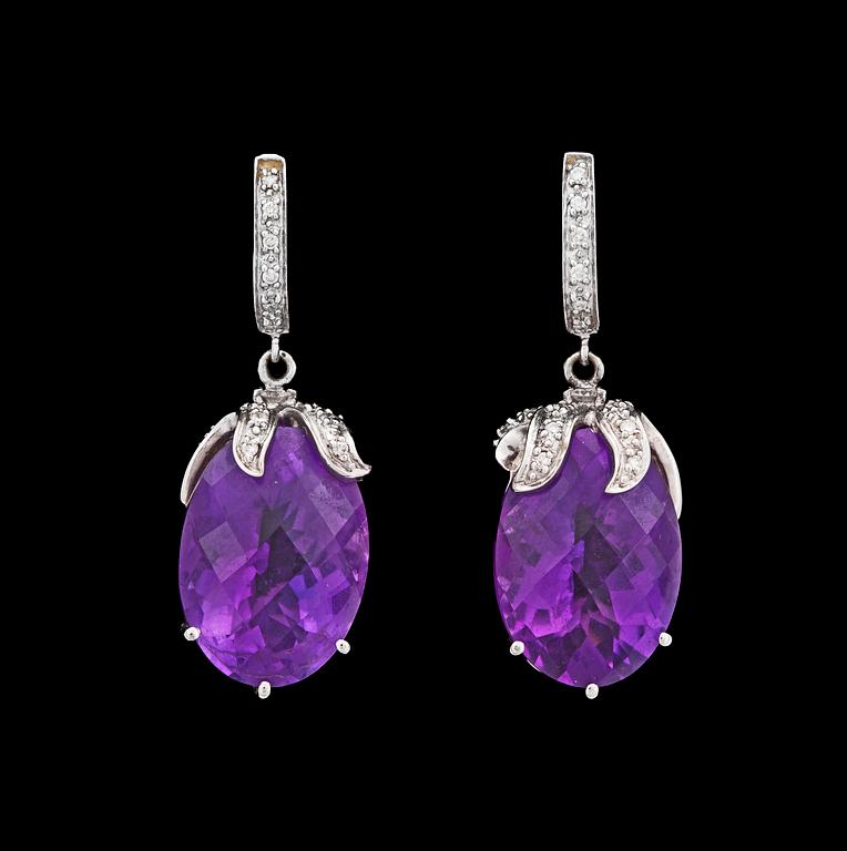 A pair of amethyst and brilliant cut diamond earrings, tot. app. 0.40 cts.