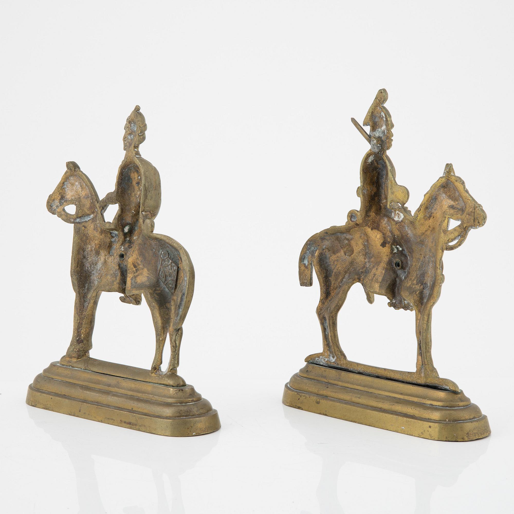 A pair of brass book stands,