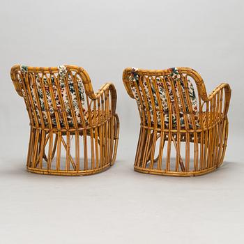 A pair of mid-20th-century rattan armchairs.
