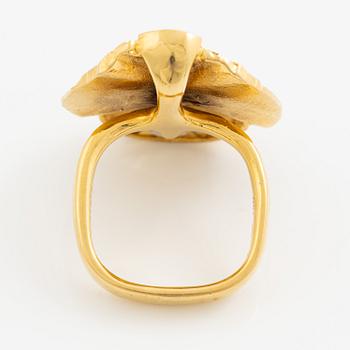 A ring, 18K gold with a fancy-cut smoky quartz and round brilliant-cut diamonds.