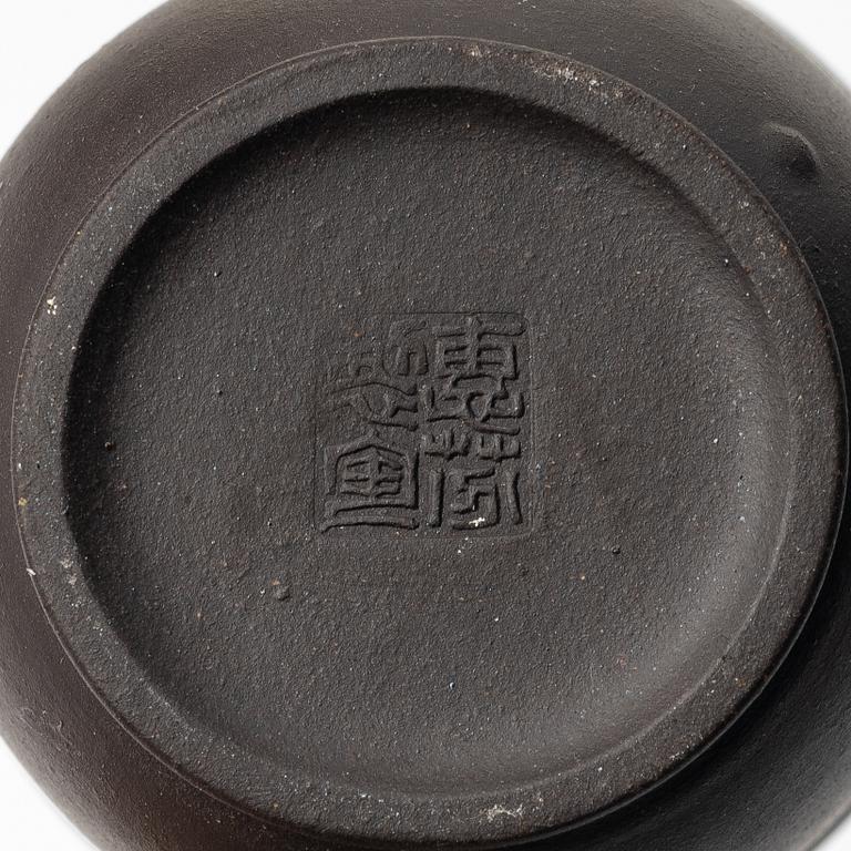 A group of three yixing teapots and a box with cover, China, 1970/80s.