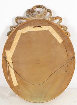 A gustavian style mirror, first half of the 20th century.