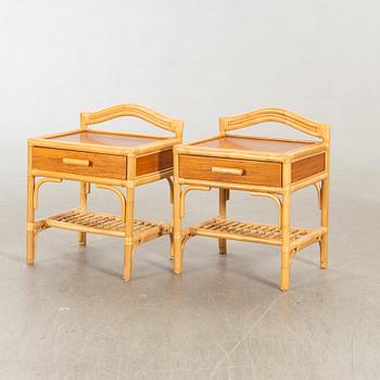 A pair of 1980s Dux rattan bedside tables.