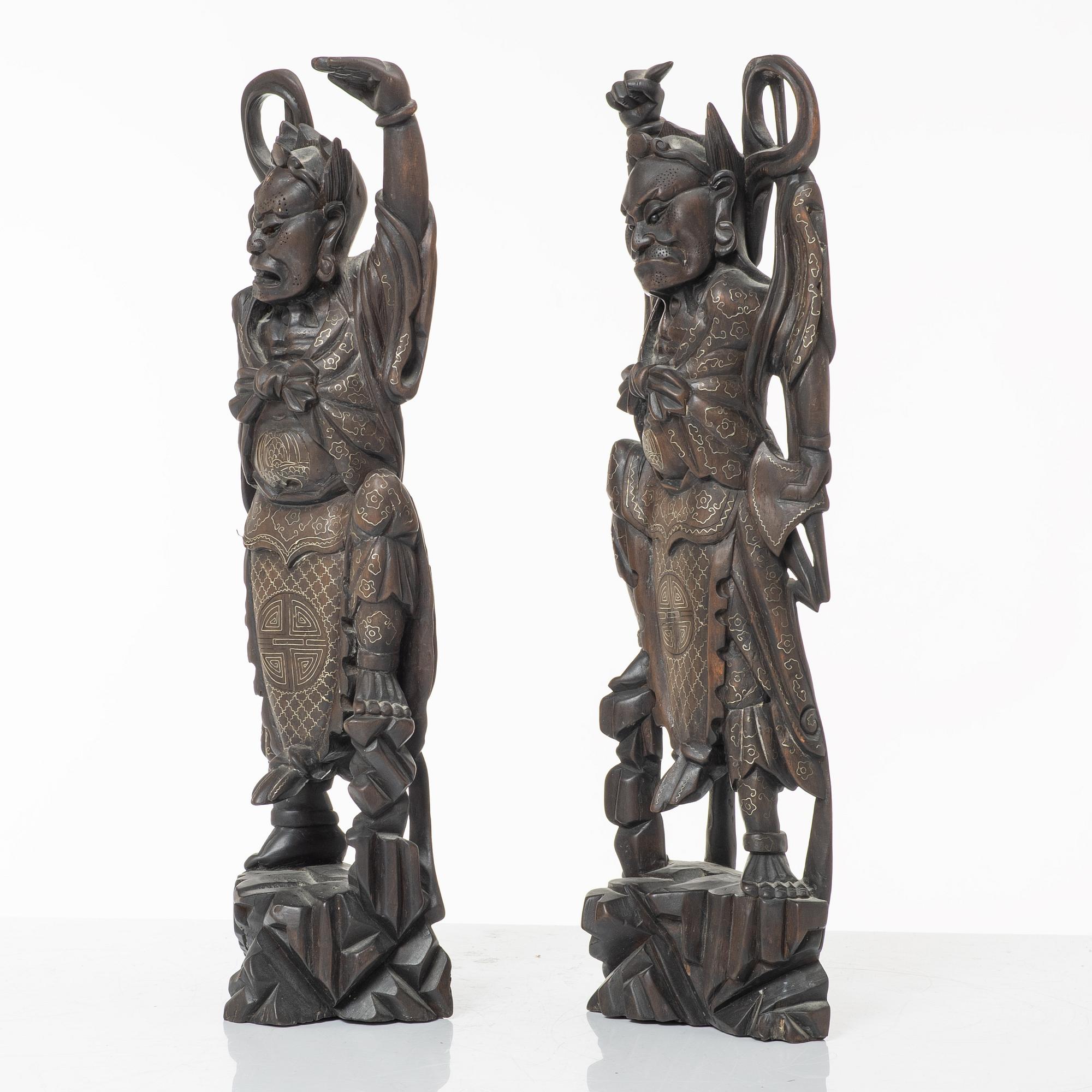 A pair of Chinese hardwood figures, 20th century.