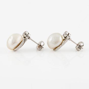 A pair of platinum earrings with bouton pearls and old-cut diamonds.