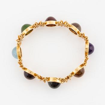 A W.A. Bolin bracelet, design Barbro Littmarck, 18K gold with cabochon-cut coloured stones, Stockholm 1970.