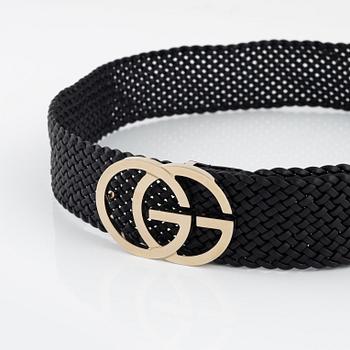 Gucci, a leather belt.