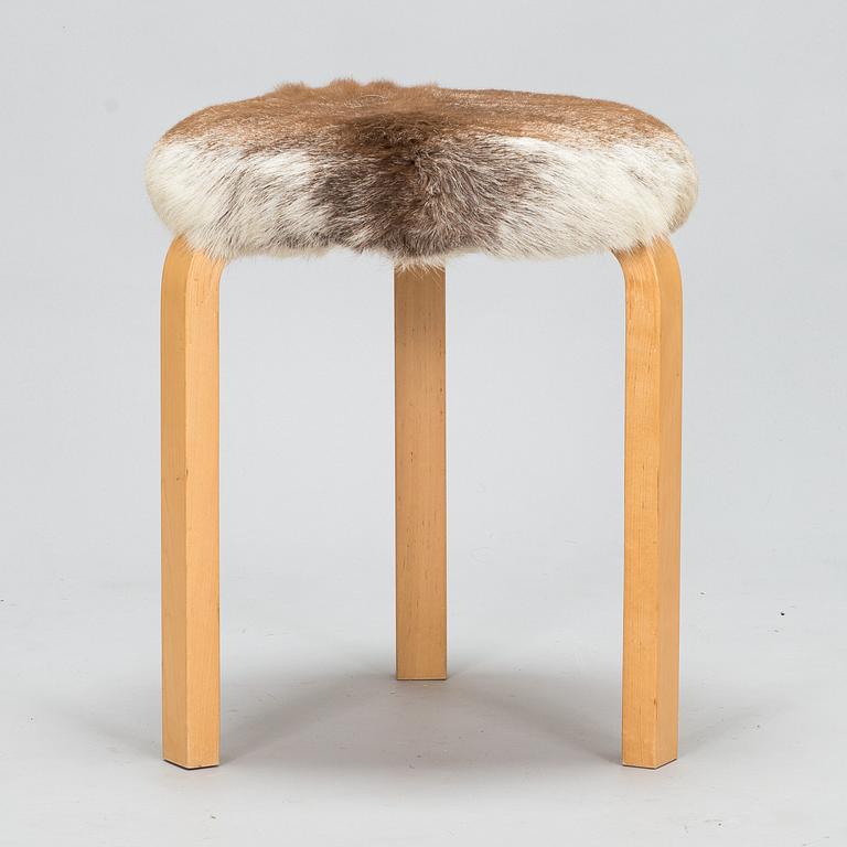 Alvar Aalto, a stool model 60 for Artek 2010. Upholstery design Ilse Crawford.