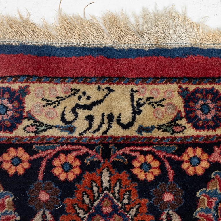 A semi-antique Mashad carpet, Eastern Iran, signed c. 507 x 303 cm.