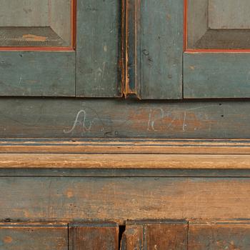 A polychrome-painted cabinet from Jämtland, Sweden, dated 1824.