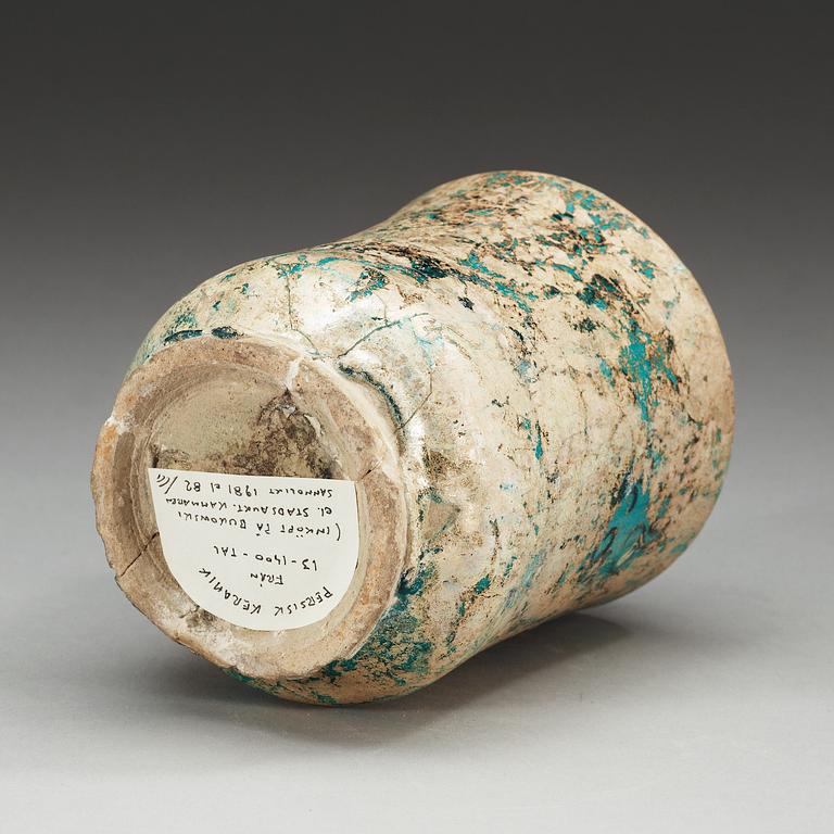 ALBARELLO, lergods. Turkos glasyr och svart dekor. Höjd 18 cm. Persien, Keshan tidigt 1200-tal.