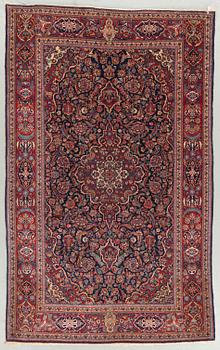 A semi-antique Kashan, around 209 x 130 cm.