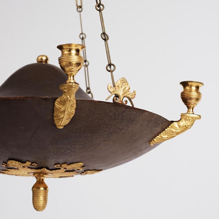 A Swedish Empire ormolu and tole six-branch chandelier, Stockholm, early 19th century.
