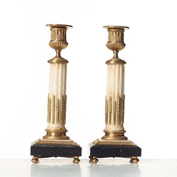 A pair of Louis XVI candlesticks.