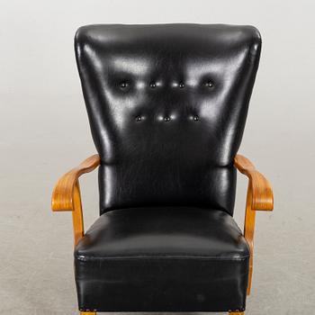 A 1940's - 50's easy chair in black leather, Scandinavian.