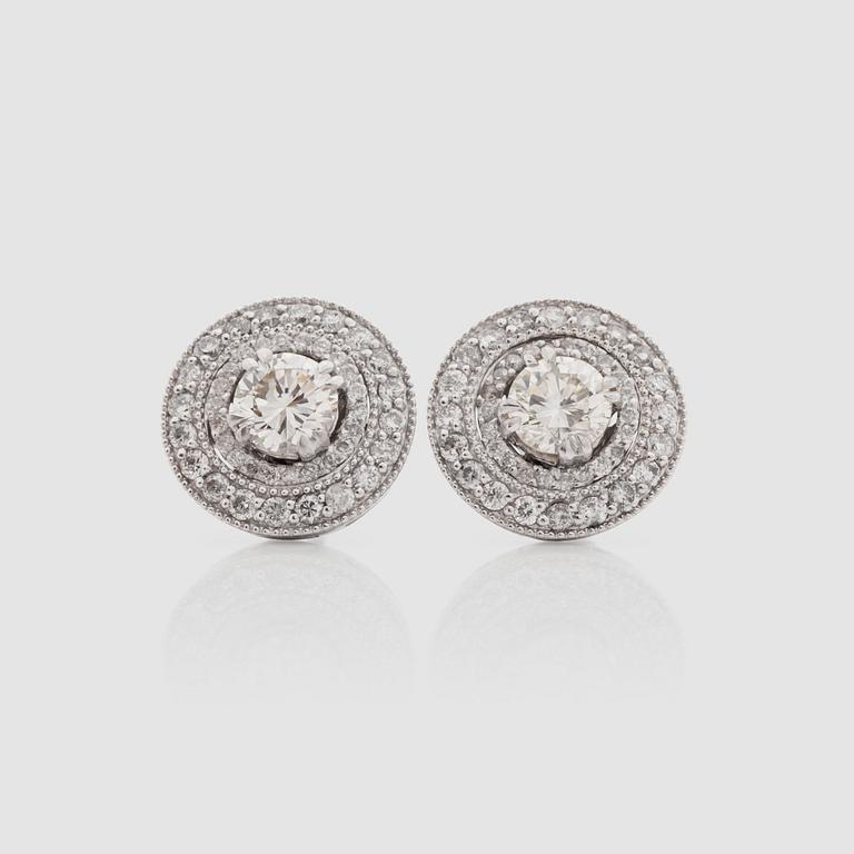 A pair of brilliant-cut diamond earrings. Total carat weight 1.64 cts.