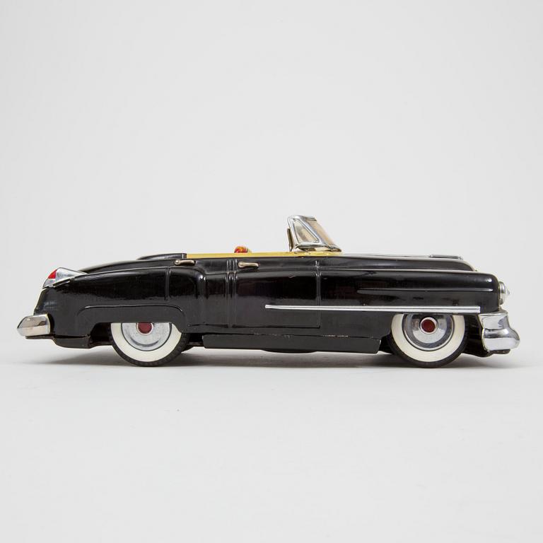 A Nomura Toys Cadillac Japan 1950s.