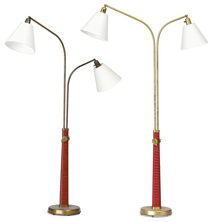 A pair of Hans Bergström brass and red leather floorlamps, Ateljé Lyktan, Sweden, 1940's.