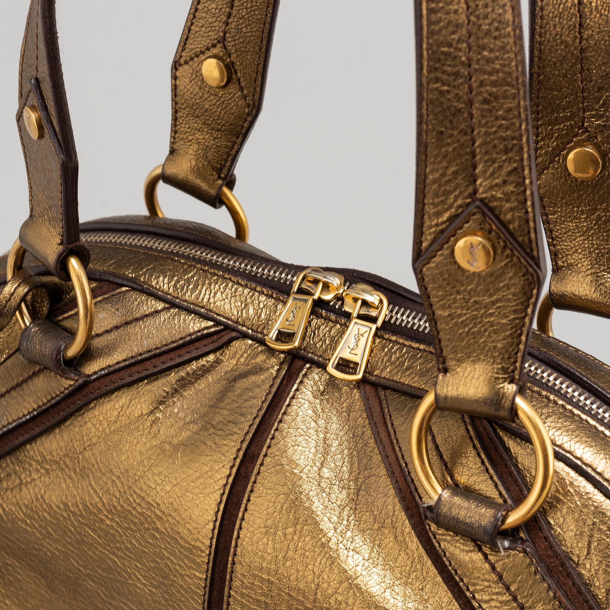 YVES SAINT LAURENT, a metallic bag.