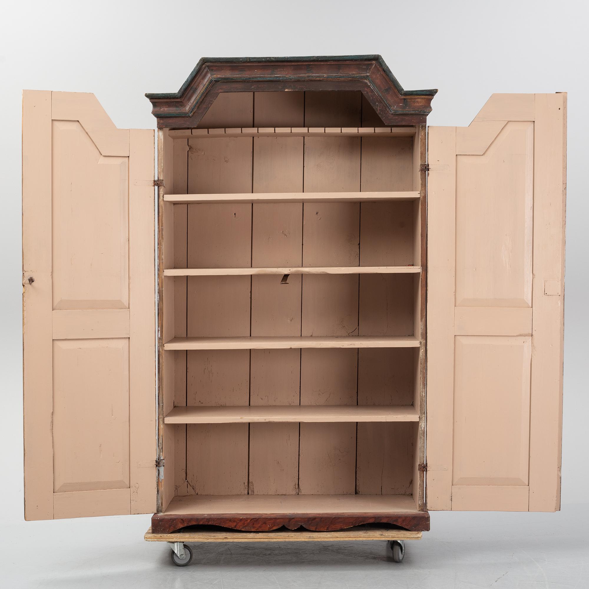 A Swedish painted cupboard dated 1863.