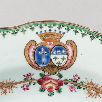 A pair of armorial dinner plates and a group of three odd famille rose plates, Qing dynasty, Qianlong (1736-95).