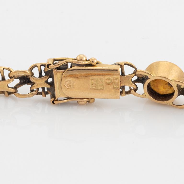 Armband  18K guld med multifärgade stenar.