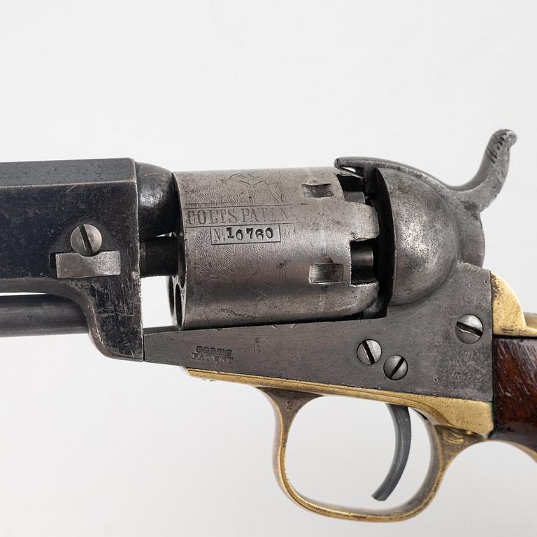 A Colt 1849 Pocket Revolver.