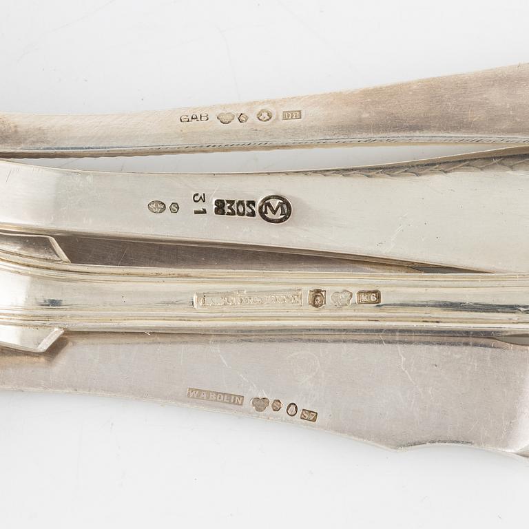 Silver cutlery in different models, including mark of CA Björklund, Stockholm 1888 (21 pieces).