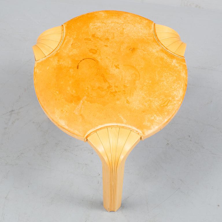 A model X 602 stool by Alvar Aalto.