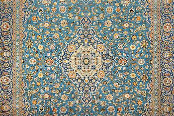 A Kashan carpet, signed Isfahanian, a. 407 x 310 cm.