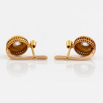 A pair of 18K gold earrings set with old-cut diamonds.