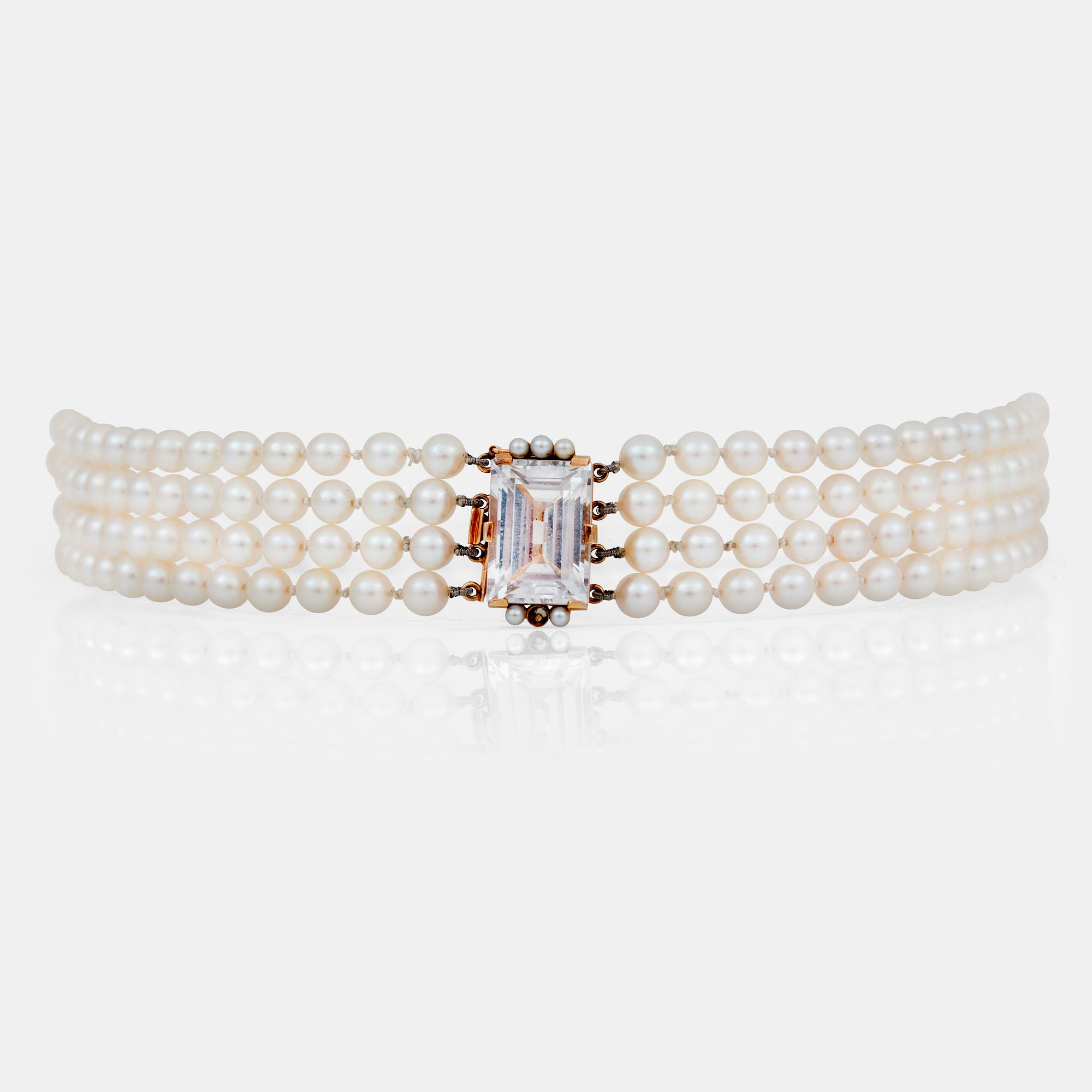 A 4-strand cultured pearl necklace. Clasp set with rock crystal.