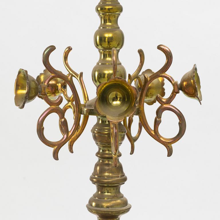 A baroque-style brass eighteen-branch chandelier, late 19th century.