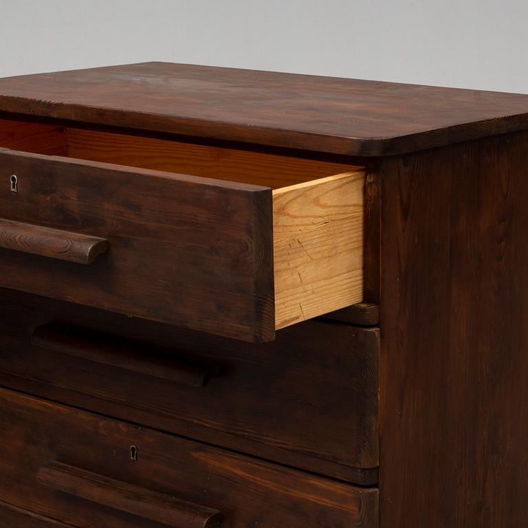 AXEL EINAR HJORTH, an attributed, stained pine chest of drawers, 1930's.