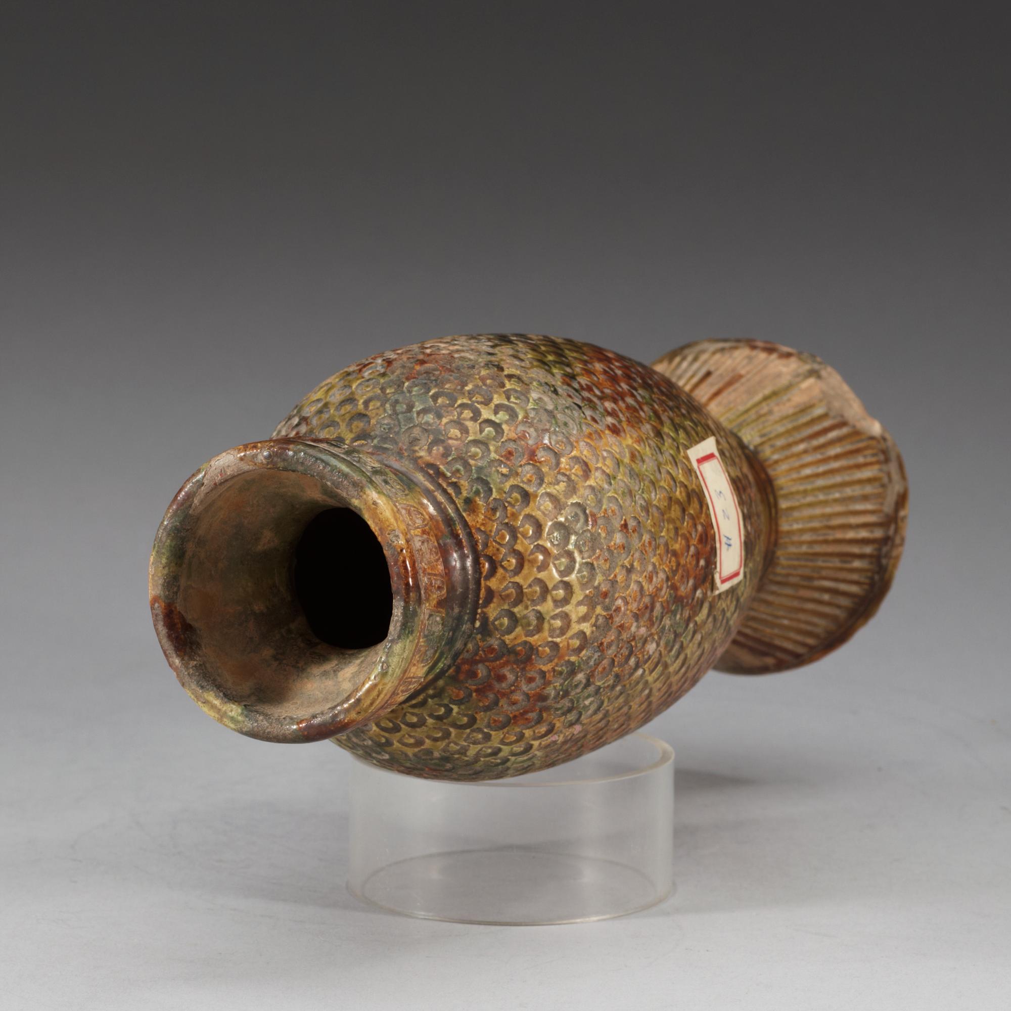 A potted fish shaped vase, presumably Tang dynasty.