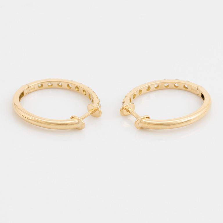 Brilliant cut diamond hoop earrings.