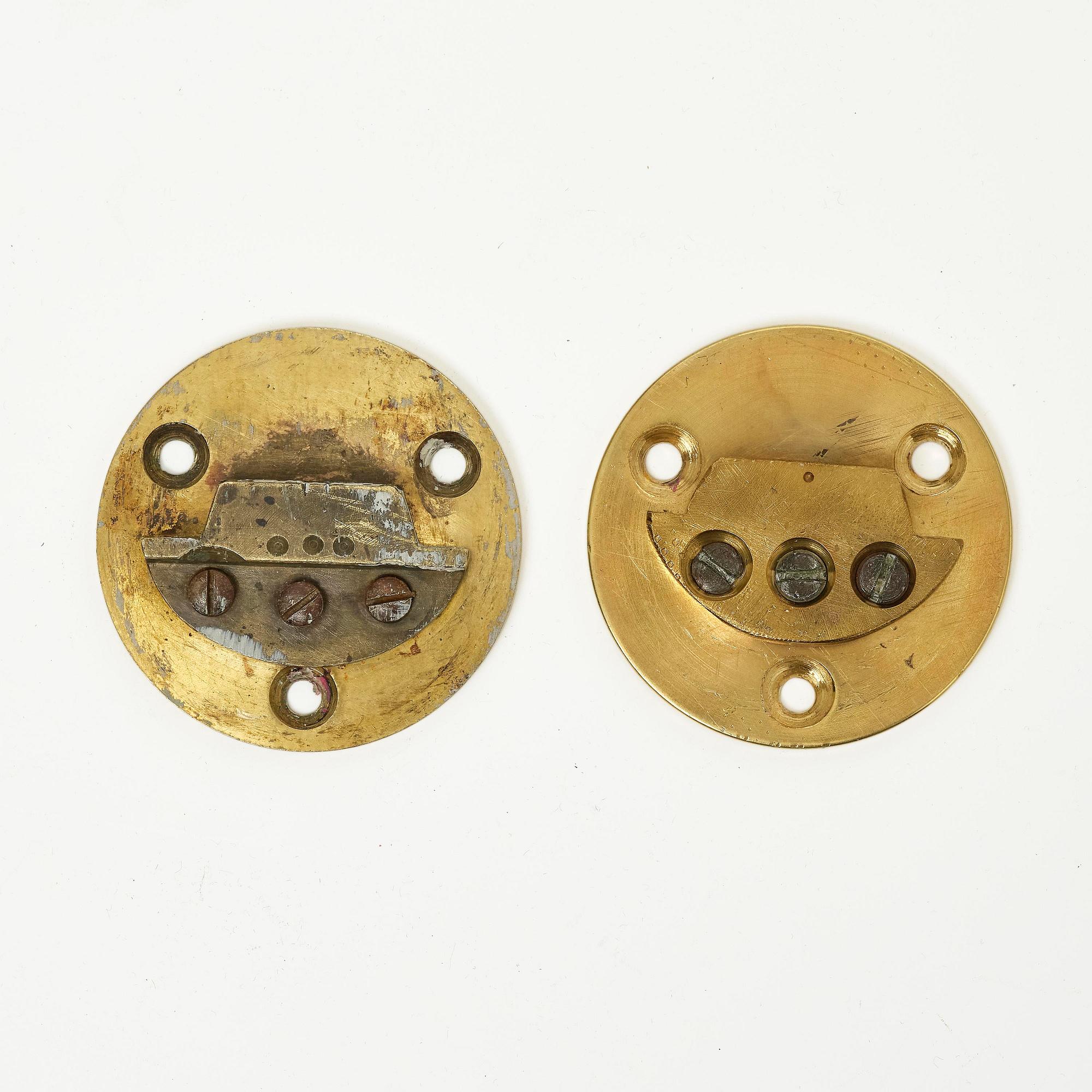 A pair of French Empire six-branch ormolu appliques, ca 1820's.