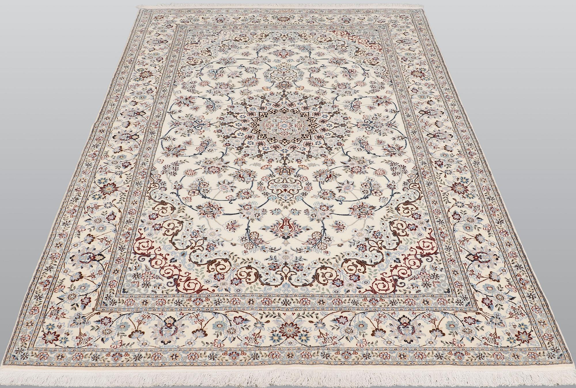A Nain part silk carpet, 244 x 156 cm.