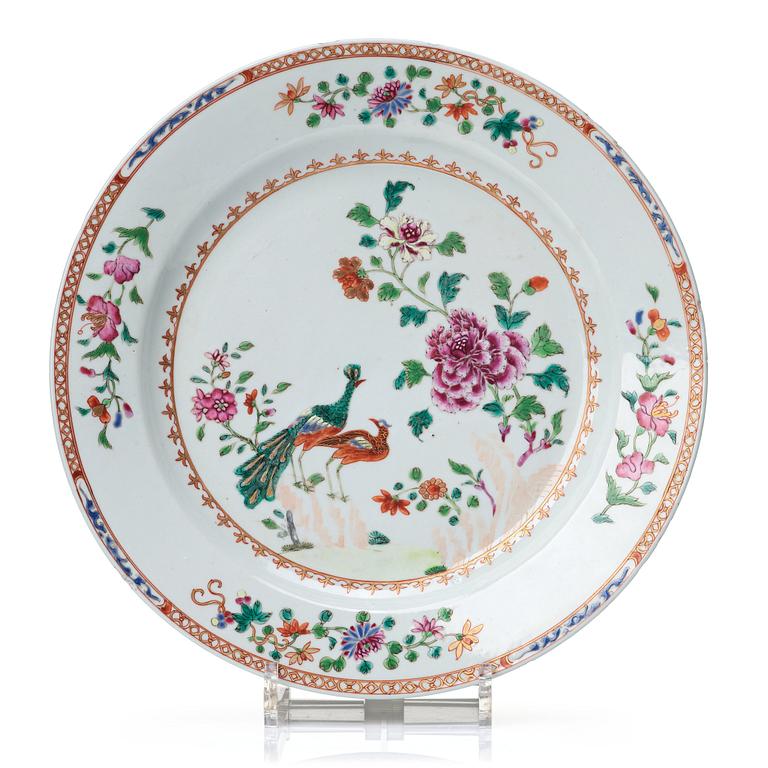 A round famille rose 'double peacock' serving dish, Qing dynasty, Qianlong (1736-95).