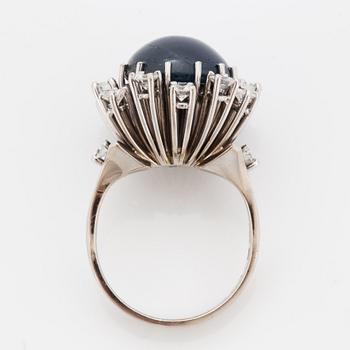 Cabochon-cut sapphire and brilliant-cut diamond cocktail ring.