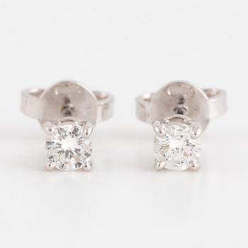 Brilliant-cut diamond stud earrings.