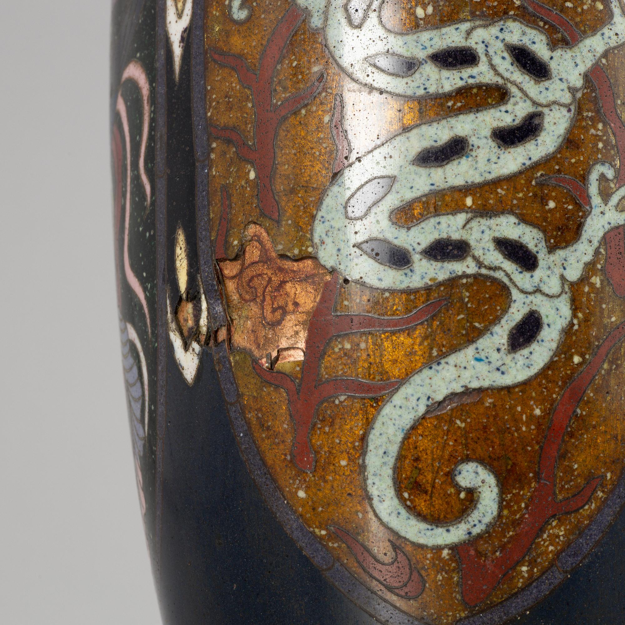 A Japanese cloisonné vase and a porcelain 'a thousand faces' satsuma dish, Meiji (1868-1912) and 20th century.