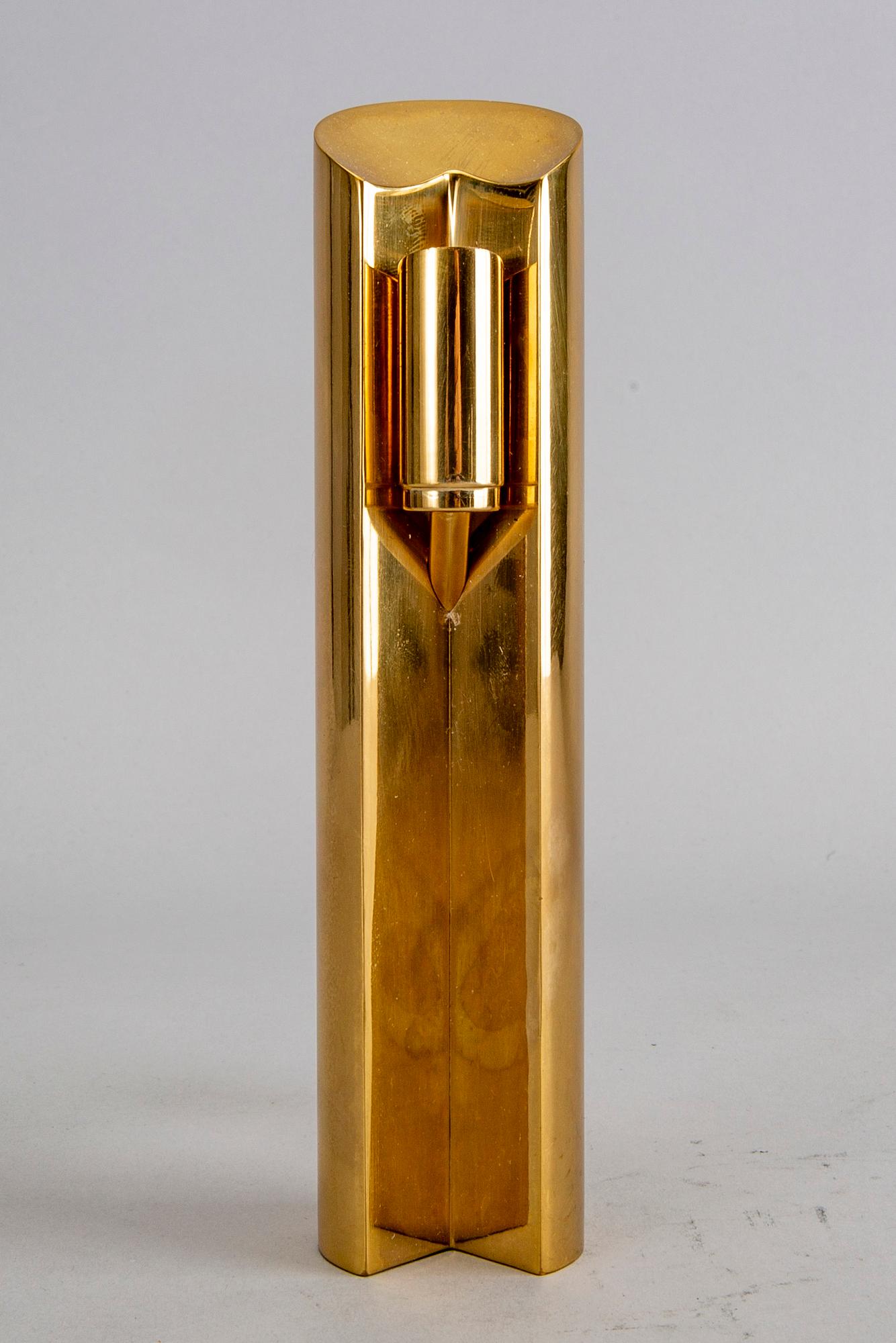 A Pierre Forssell brass candle stick for Skultuna.