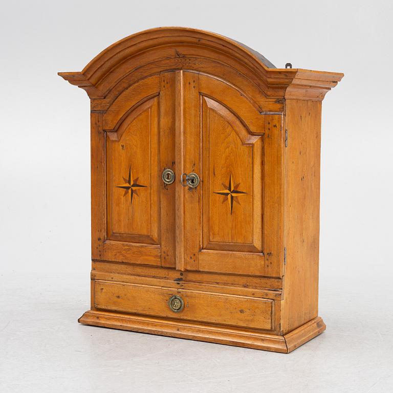 A wall cabinet, 18th century.