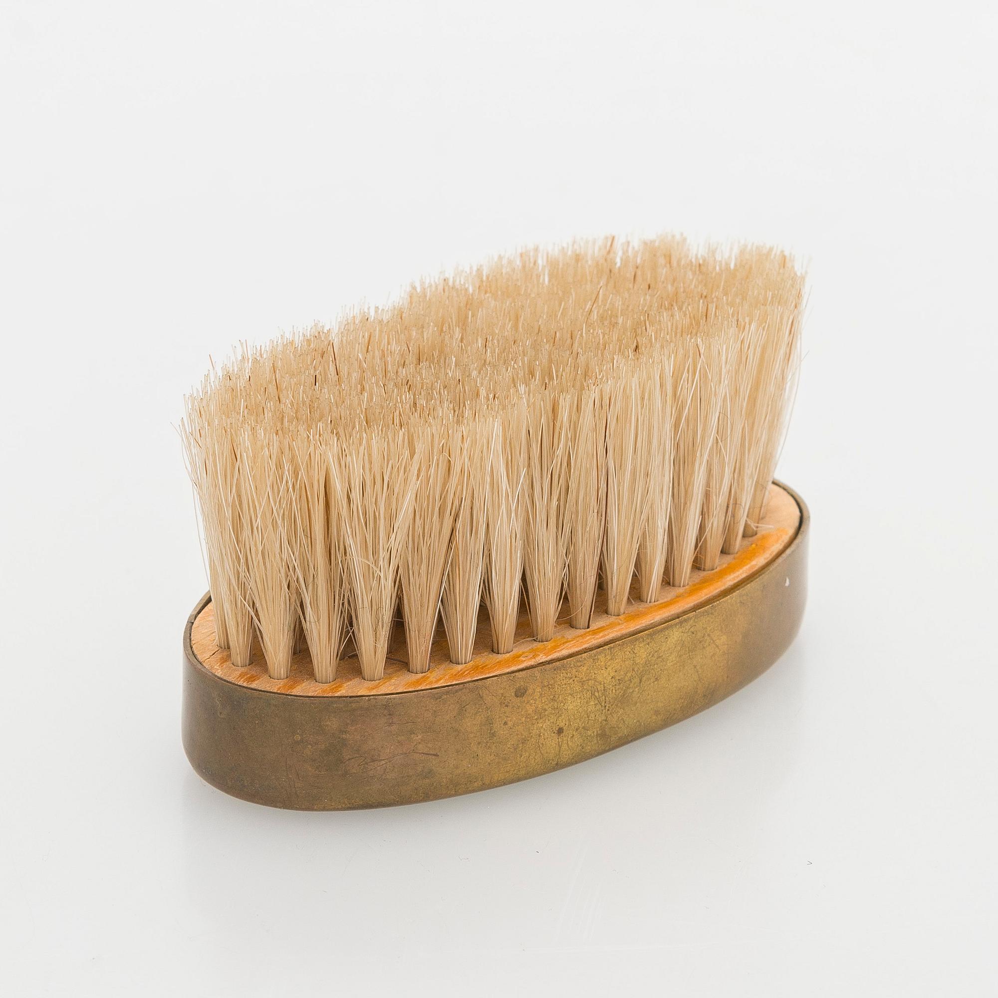 Maija Heikinheimo, A 1960s hand clothes brush for Valaistustyö for Artek, Finland.
