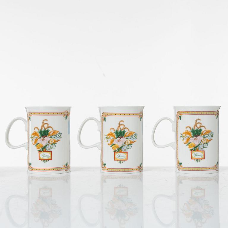 Gucci, A set of six vintage christmas mugs.