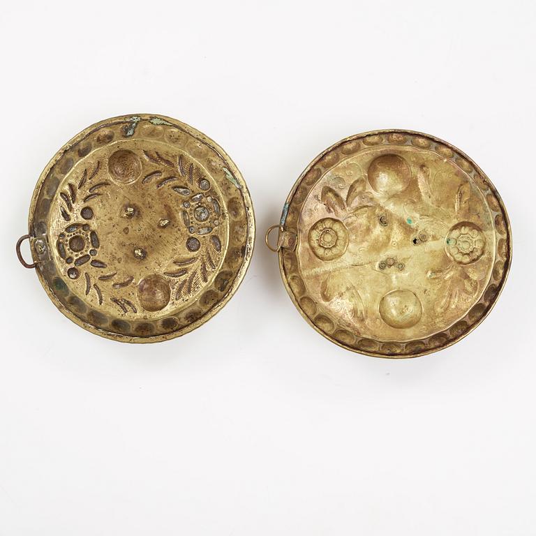 two brass candle holders from the 18th century.