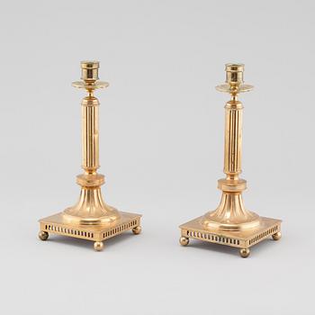 A pair of gustavian style brass candle sticks by Grillby Metal factory, Sweden, first half of the 20th century.